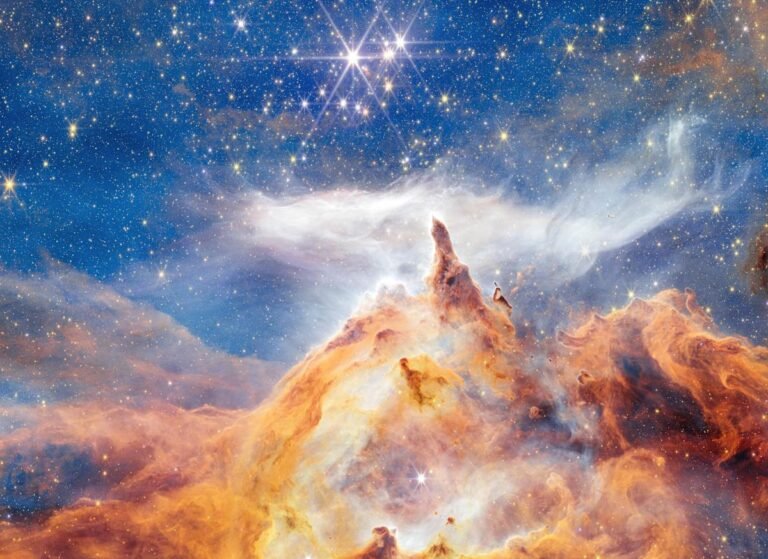 New Webb image shows star formation as glittering, craggy peaks