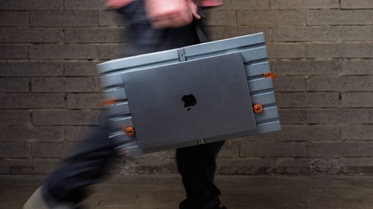 Someone designed an open portable desk with a canvas handle to carry your $10,000 Apple MacBook Pro laptop around